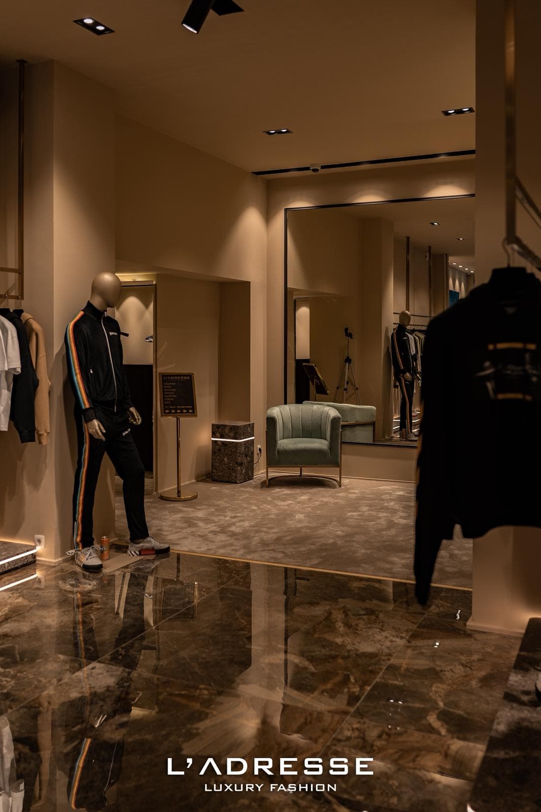 Fitting lounge with full-length mirror and velvet seating