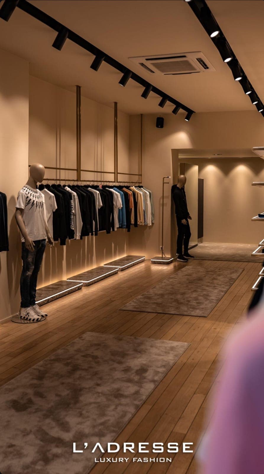 Interior of the boutique with menswear displays